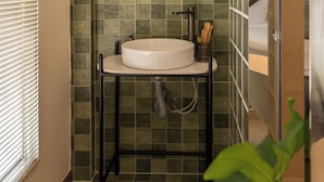 A bathroom with a round mirror, a sink, and a shower. - Saigon Maison 1988 Bui Vien Central (Ho Chi Minh City)