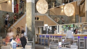 A modern bar area with seating and a staircase. - Stylish Stay With Terrace & Wellness (Tignes)