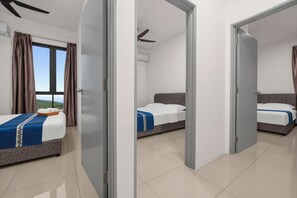 A hotel room with two beds, a view of the sky, and a ceiling fan. - KLIA Residensi---15minutes drive to KLIA (Labu)