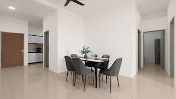A modern dining area with a table, chairs, and a ceiling fan.