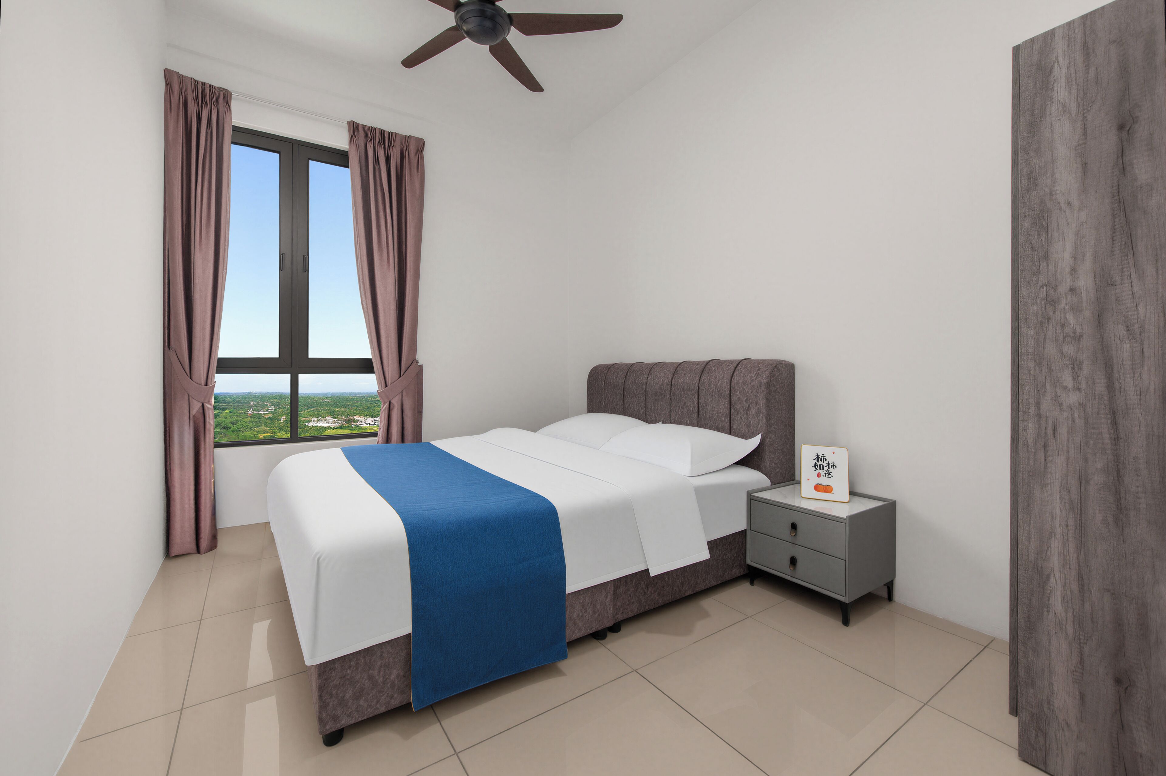 A bedroom with a bed, nightstand, and window with curtains.