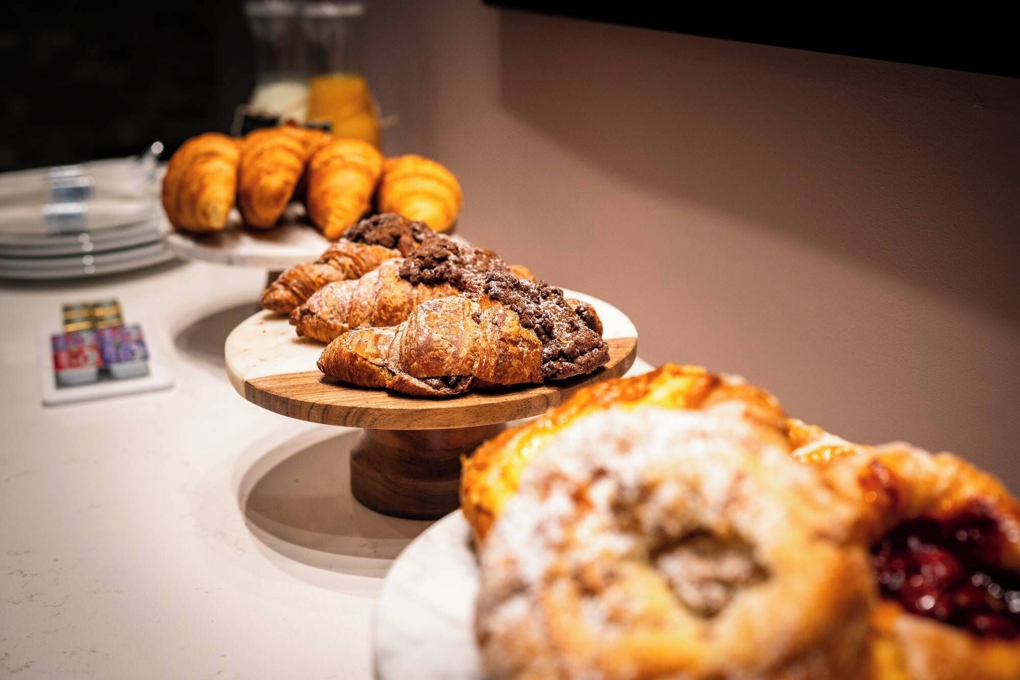 A variety of pastries displayed on a wooden board.