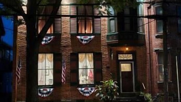 A brick building with multiple windows, a door, and a small porch area. - Langdon Hill House (Gettysburg)