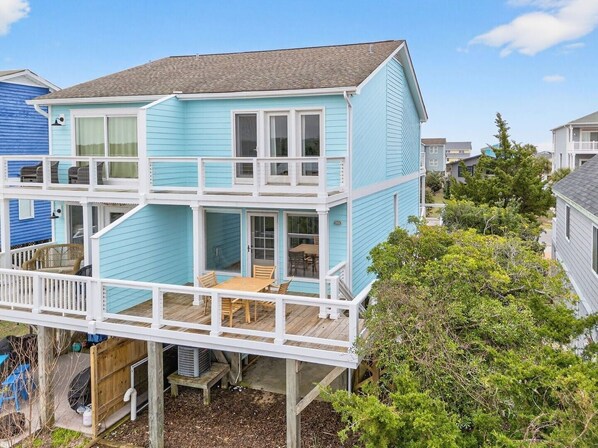 A two-story house with a balcony and a deck. - Times Like These / 256a Brunswick Ave West 2 Bedroom Home (Supply)