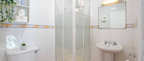 Shower, hair dryer, towels, soap