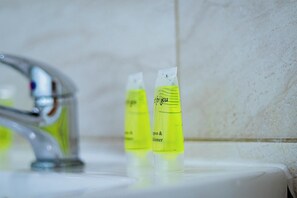 Two yellow bottles labeled 'for you' on a bathroom sink. - Chic 1BR Ground Floor Apartment Near Centre (Cardiff)