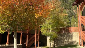 A building with a wooden staircase and a stone wall. - Breckenridge 1BR + Den - Family-Friendly, Steps to Swan River & CO Trail (Breckenridge)