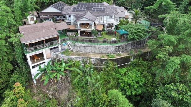 A large house with multiple levels, surrounded by dense forest. - Hickory Penang Hill (George Town)