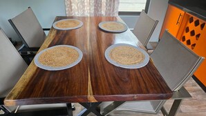 A wooden dining table with four woven placemats, surrounded by metal chairs. - House With a Private Pool (Ciudad Cortés)