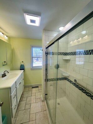 Shower, towels, soap, toilet paper