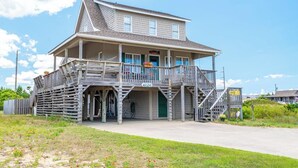 A two-story building with a balcony, a porch, and a visible number '4126'. - JL #296 | East Of Eden - Semi-Oceanfront - Horizon Ocean View - Private Pool (Nags Head)