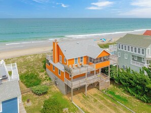A beachfront house with a balcony, a deck, and a view of the ocean. - JL #228 | Tengerhaz | Oceanfront | Ocean Views (Duck)