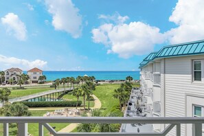 A beachfront hotel with a pool, a bridge, and a view of the ocean. - Amalfi Coast 413B - Gulf Views, Two Community Pools, Tennis! (Miramar Beach)