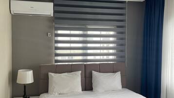 Suíte família | Cofres nos quartos, cortinas blackout, ferros/tábuas de passar roupa