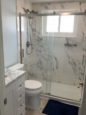 Shower, hair dryer, towels, soap