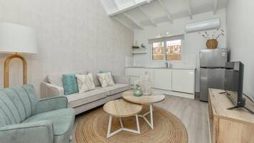 Comfort Apartment, Garden View | Living area