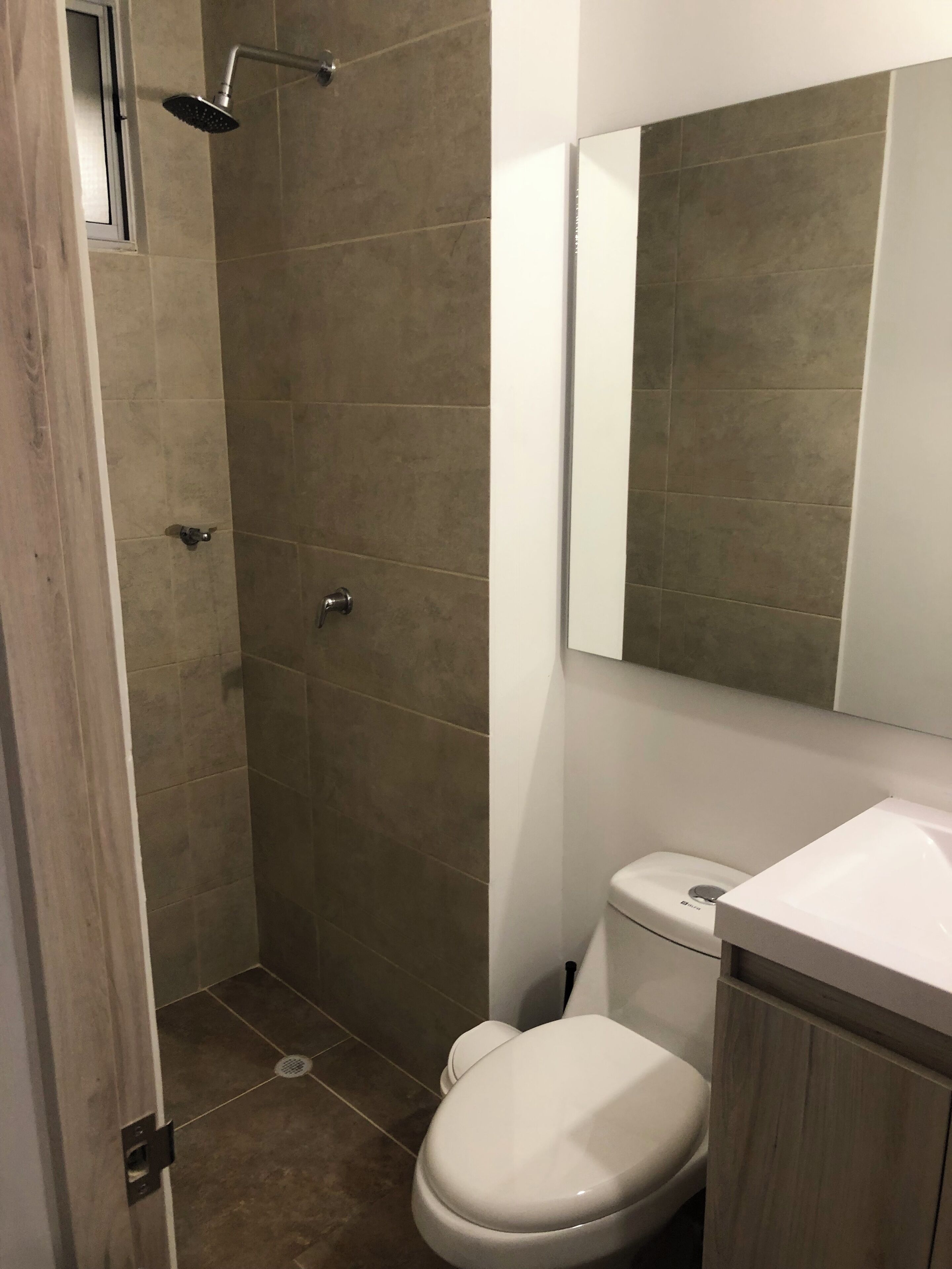 Shower, towels, soap, toilet paper