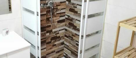 Shower, hair dryer, towels, soap