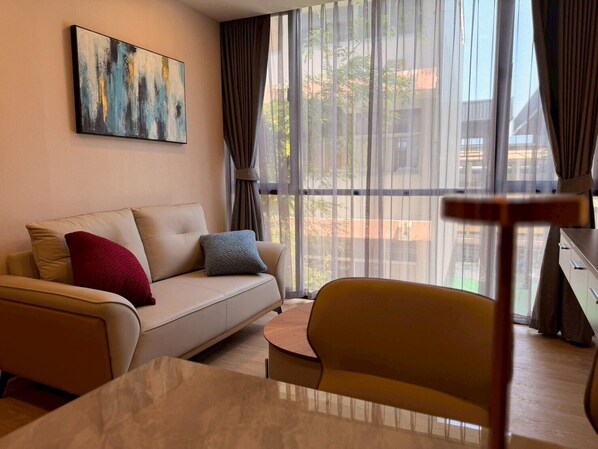 Family Quadruple Room, Balcony, City View | Living area - The Iconic (Muang Pattaya)
