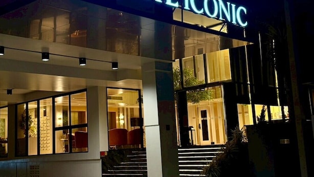 A hotel entrance with a prominent illuminated sign reading 'THE ICONIC.' - The Iconic (Pattaya)
