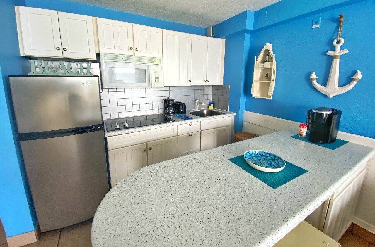 Fridge, microwave, stovetop, coffee/tea maker