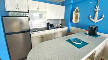 Fridge, microwave, stovetop, coffee/tea maker