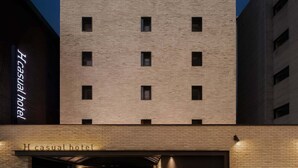 A modern building with a prominent 'H' sign, indicating a hotel. - H Hotel Wangsimni (Seoul)