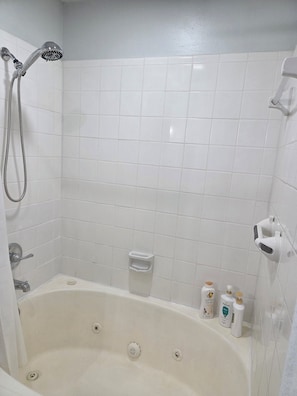 Jetted bath, hair dryer, towels, soap