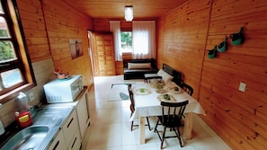 Fridge, microwave, coffee/tea maker, cookware/dishes/utensils
