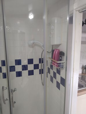 Shower, hair dryer, towels, soap