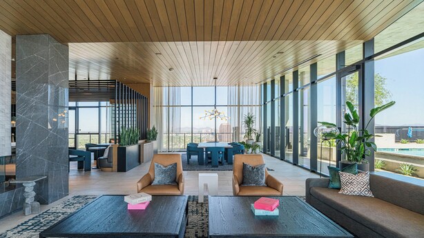A modern lobby with a wooden ceiling, large windows, and seating areas. - Deluxe Stay 5mins to Convention Center (Phoenix)