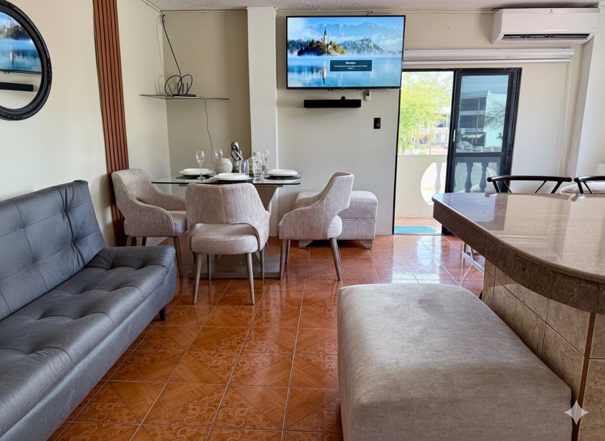 Departamento Confort, balcón, vista parcial al mar | Área de sala de estar