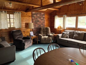 Living area - Cabin 8 "Lady Bug Lodge" 4 BR, 8 pp, wooded cabin, access to boats! (Ely)
