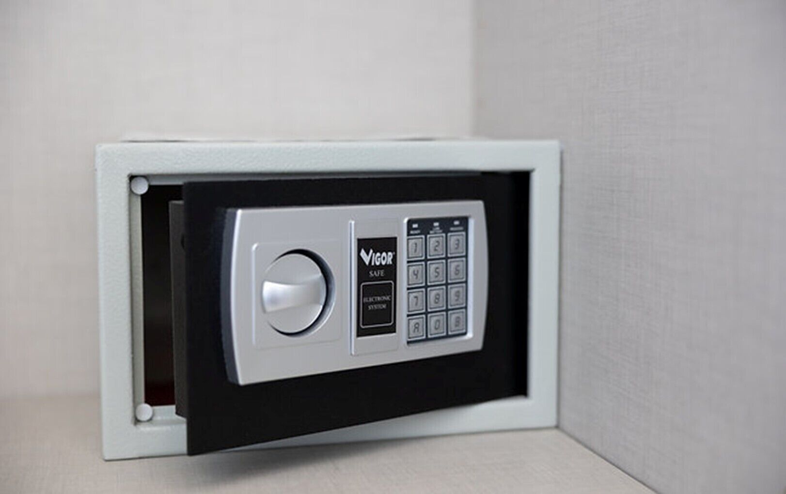 A secure electronic lock with a keypad and a keyhole, indicating a safe deposit box or secure storage feature.