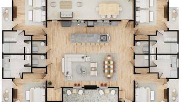 A hotel layout with multiple bedrooms, a central living area, a kitchen, and a dining area.