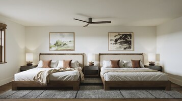 A double bed room with a ceiling fan, two bedside tables, and two wall-mounted lamps.