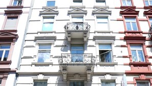A building with a 'Malibu Bar' and 'Hotel CityRing' sign, featuring a classic architectural style with multiple windows and balconies. - Hotel Cityring (Frankfurt)