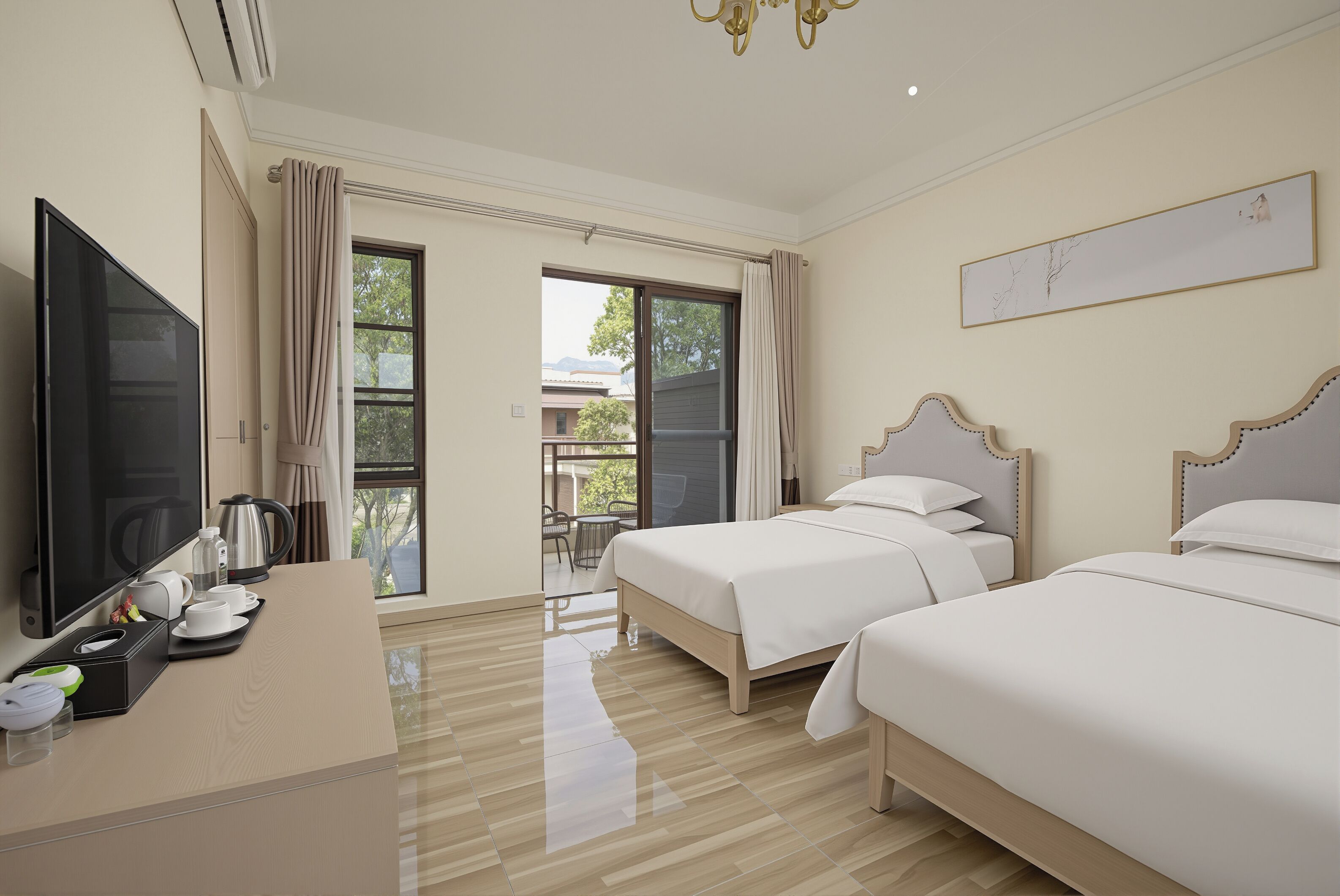 A hotel room with two beds, a TV, a desk with a coffee maker, and a view of the outdoors.