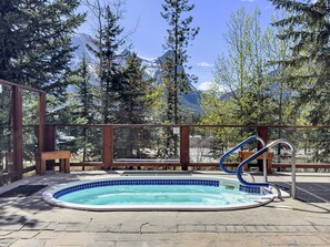 Outdoor pool, a heated pool - Rockies resort condo fits 4 with hot tub, fitness room, parking & close to town (Canmore)