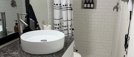 Shower, hair dryer, towels, soap