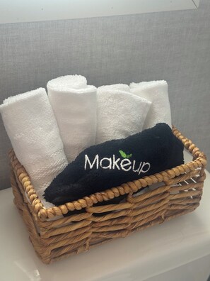 Shower, hair dryer, towels, toilet paper