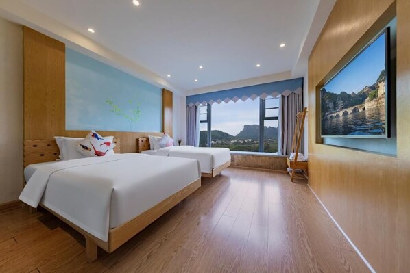A hotel room with two beds, a large window with a view of a bridge and mountains, and a painting on the wall. - Zhangjiajie Peak & Cloud Retreat (Zhangjiajie)