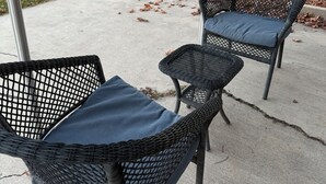 Two wicker chairs with cushions on a concrete patio. - Garden Estate at the base of the Mountains, sleeps 16, near BYU (Orem)