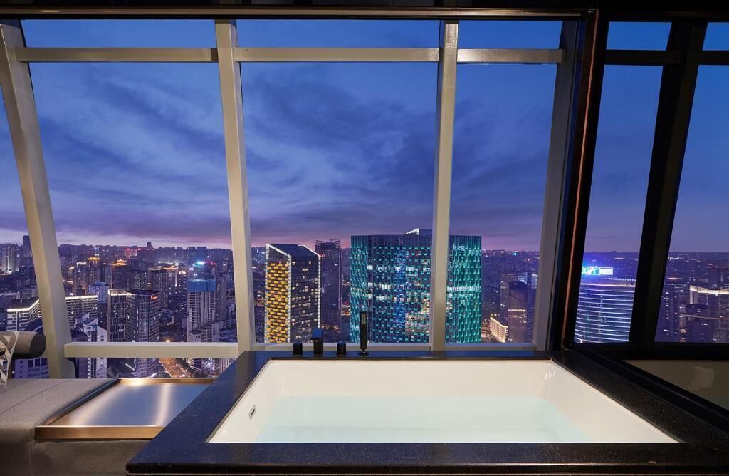 Skyline King Room (Oversized Private Hot Tub) | Bathroom | Separate tub and shower, rainfall showerhead, free toiletries