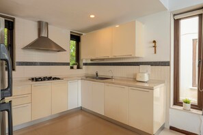 Villa, 3 Bedrooms, Pool View, Beachside | Private kitchen | Electric kettle, dining tables