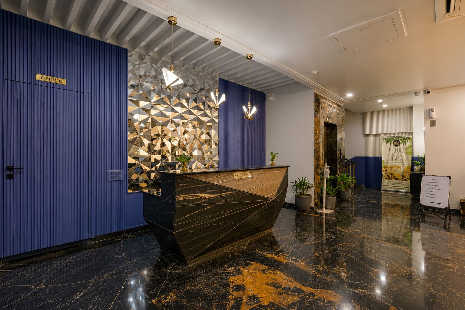 A reception desk with a geometric patterned wall behind it, a reception area, and a sign for the office.