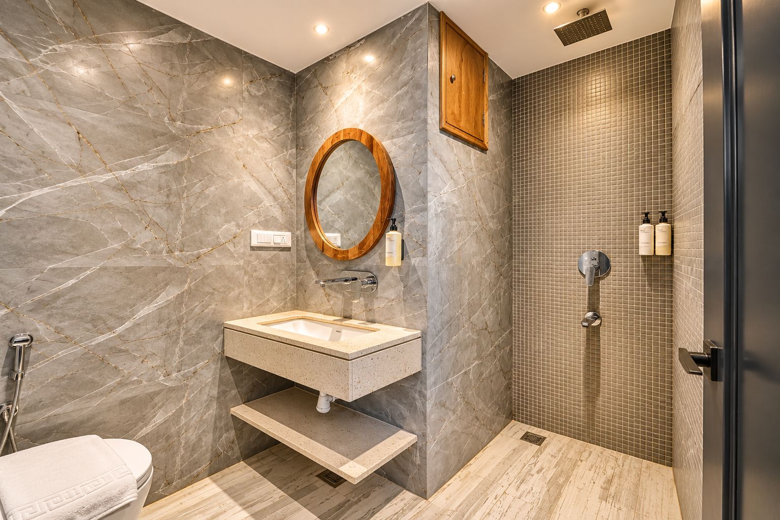 A modern bathroom with a marble vanity, a freestanding bathtub, and a shower area.
