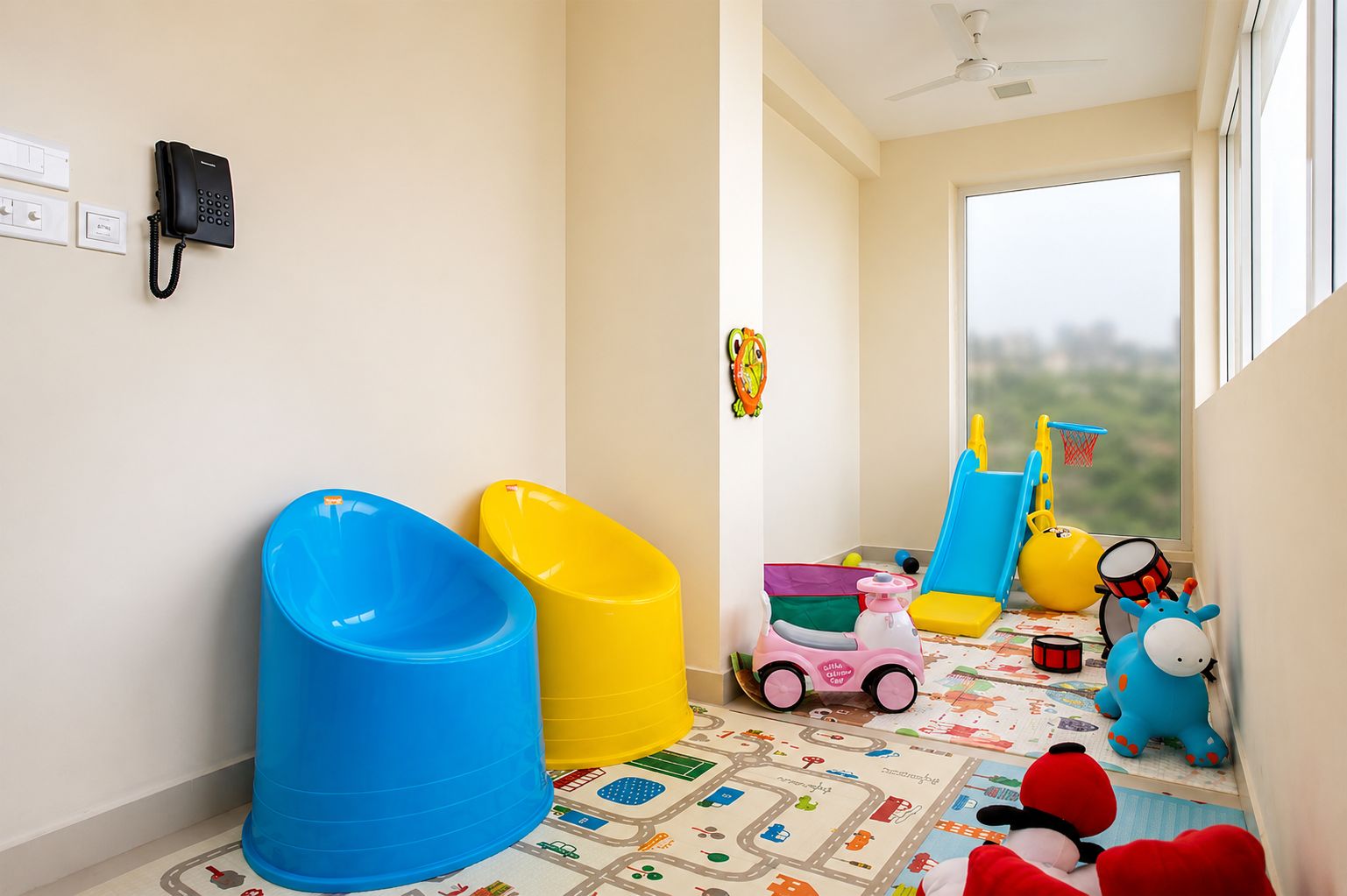 A child's play area with toys and a patterned play mat.