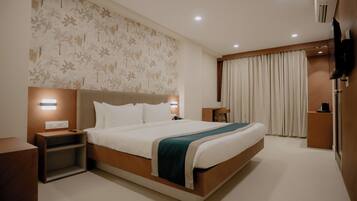 Habitación ejecutiva | Ropa de cama de alta calidad y escritorio