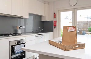 City House, Patio | Private kitchen - Lovely & Spacious 2-BR home in Norwood (Norwood)
